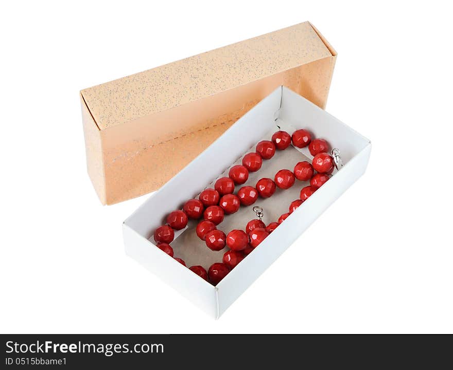 Coral necklace in a paper box isolated on white