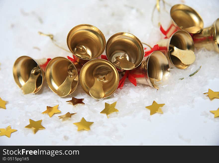 Christmas bells with golden stars in snow. Christmas bells with golden stars in snow