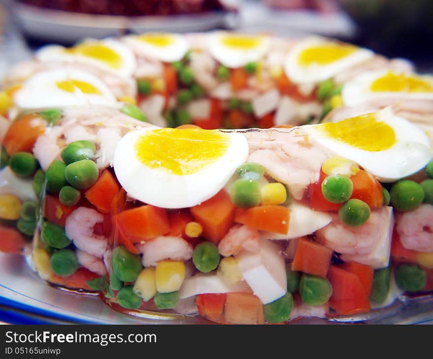 Aspic with eggs and shrimps, and vegetables