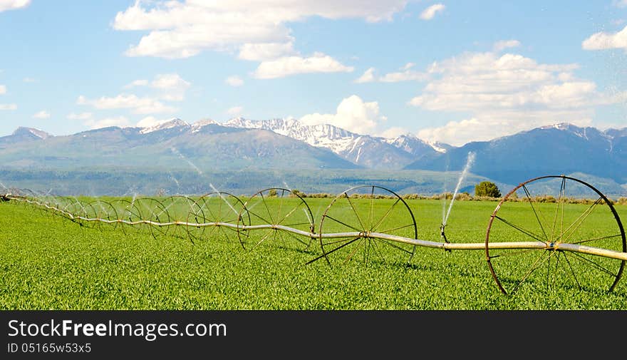 Irrigation System on Farm with San Juan Mountains in Background