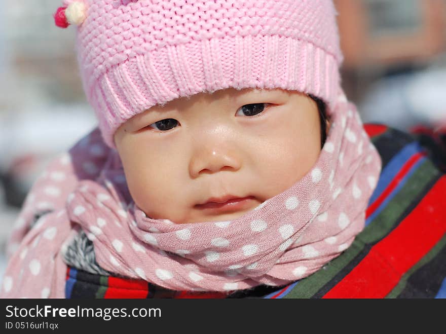 Chinese girl wearing a hat scarf. Chinese girl wearing a hat scarf