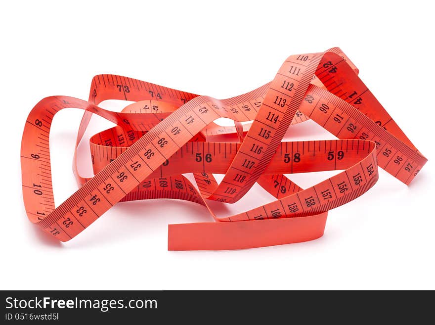 Red tape measure closeup on white background