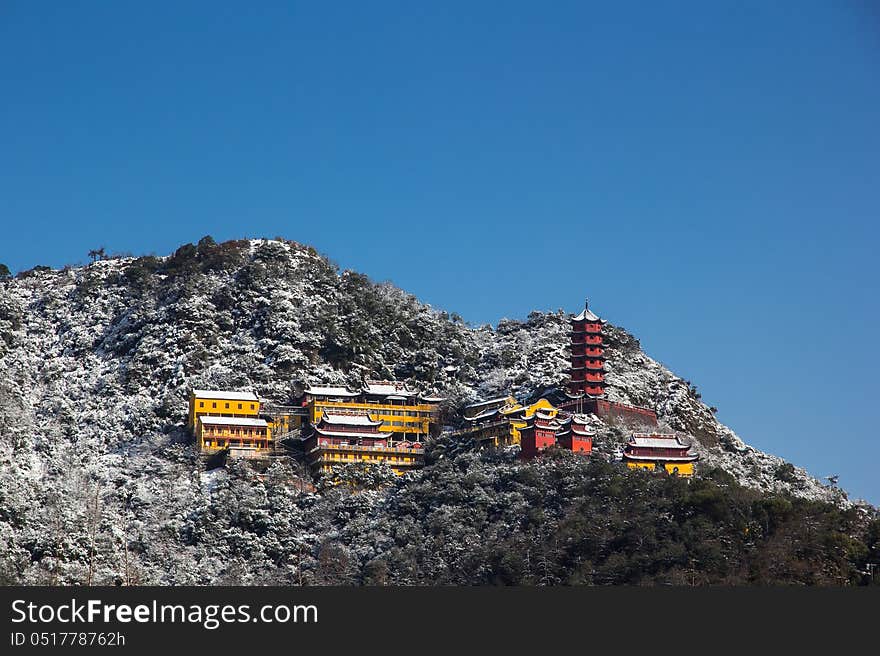 After the first snow in winter, all the mountain is covered by the snow. The snow white and the colorful temple make a beautiful contrast. After the first snow in winter, all the mountain is covered by the snow. The snow white and the colorful temple make a beautiful contrast.