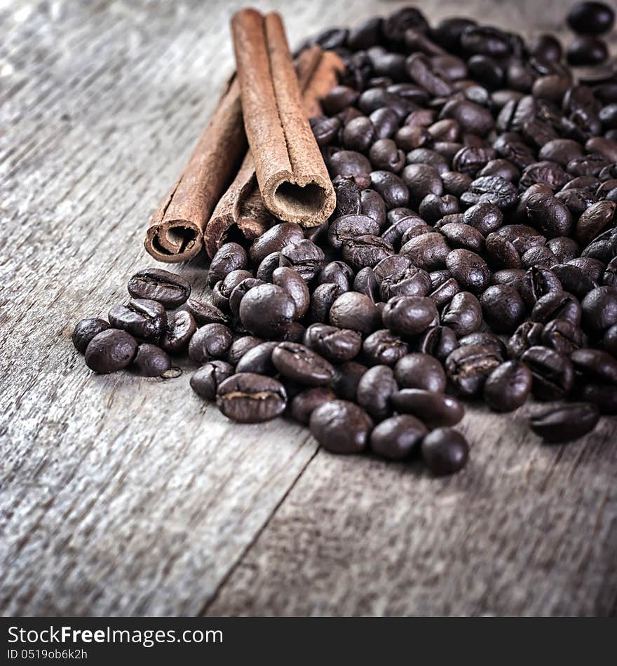 Coffee and cinnamon over grunge wood