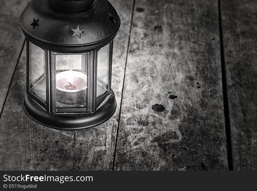 Old lamp on old wooden table,grain added