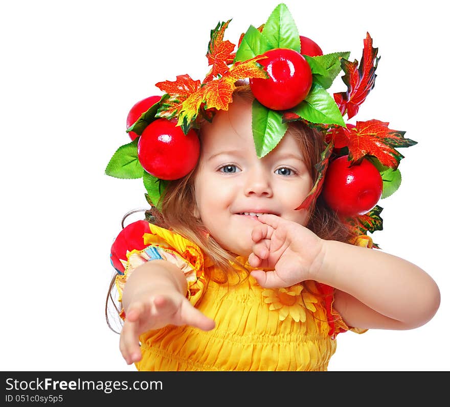 Portrait of a beautiful little girl in a wreath of leaves and apples. Portrait of a beautiful little girl in a wreath of leaves and apples