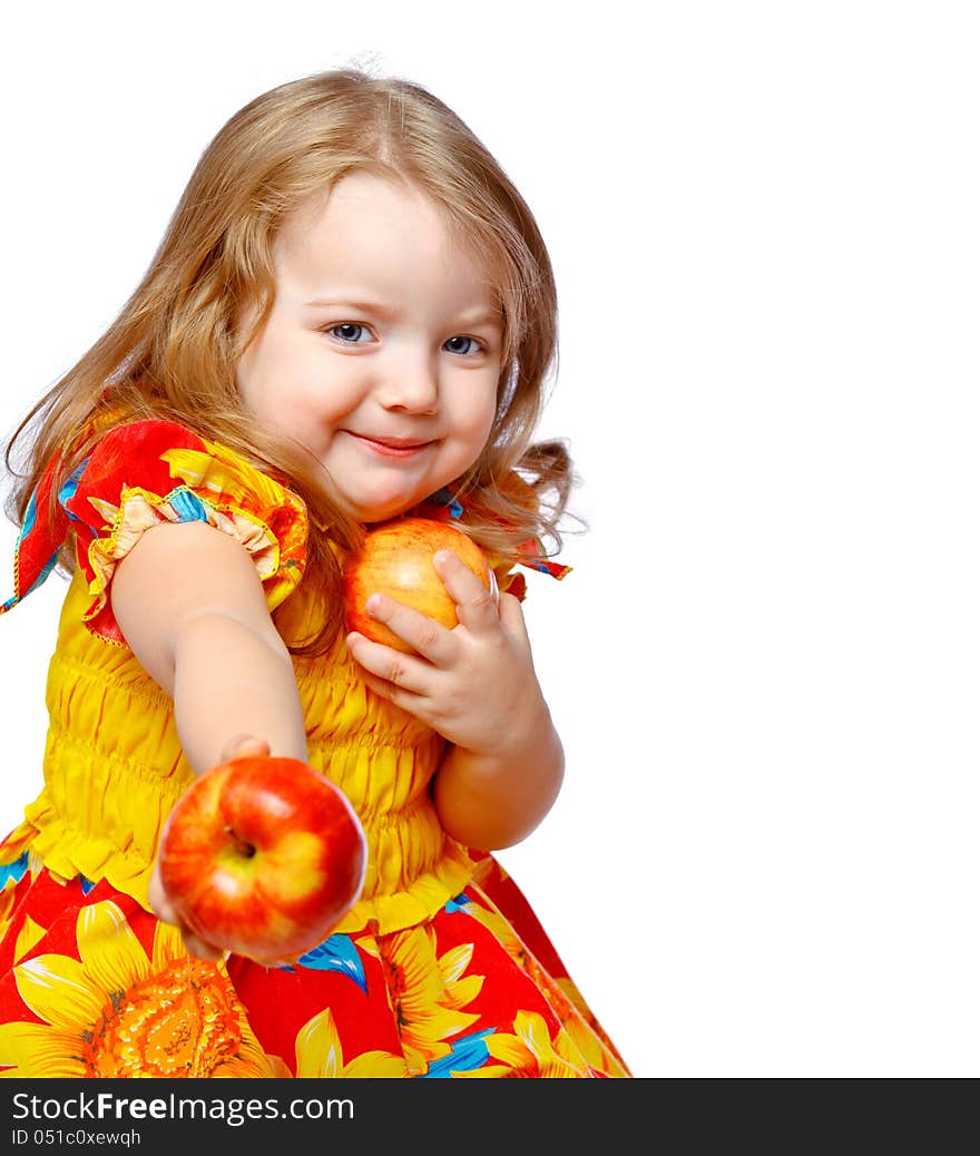 Beautiful little girl eating apples on an abstract background