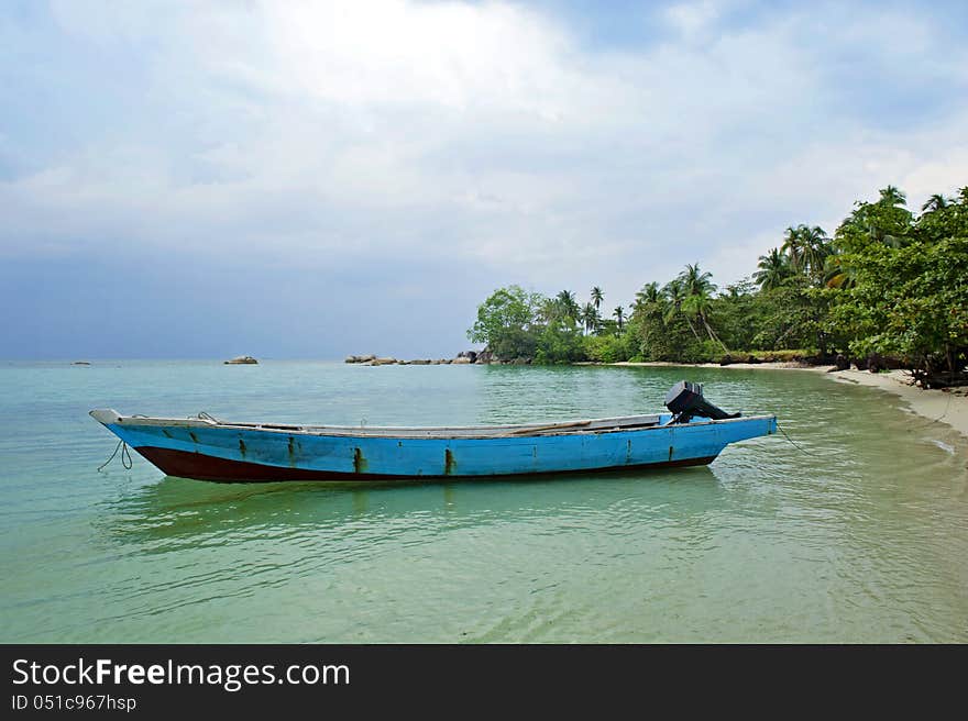 The boat, the beach and the blue sky