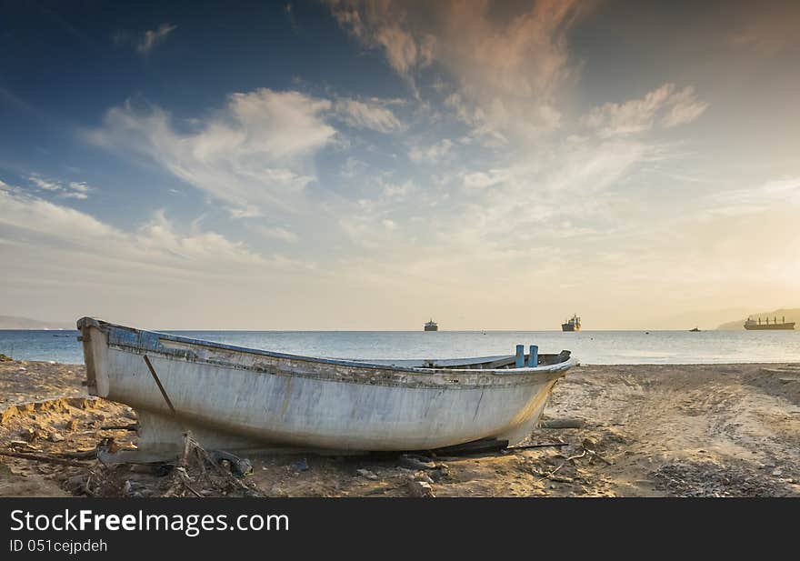 Old fishing boat after storm at the gulf of Aqaba