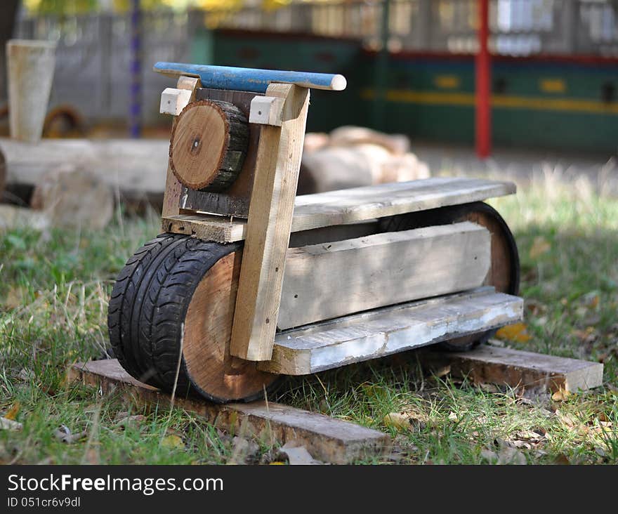 Motorcycle wood toy on grass