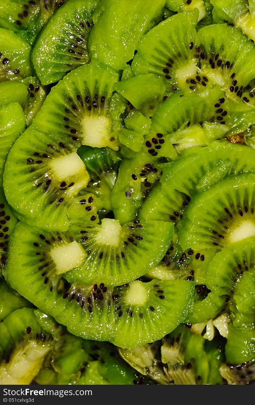 Healthy food background with green kiwi fruits slices