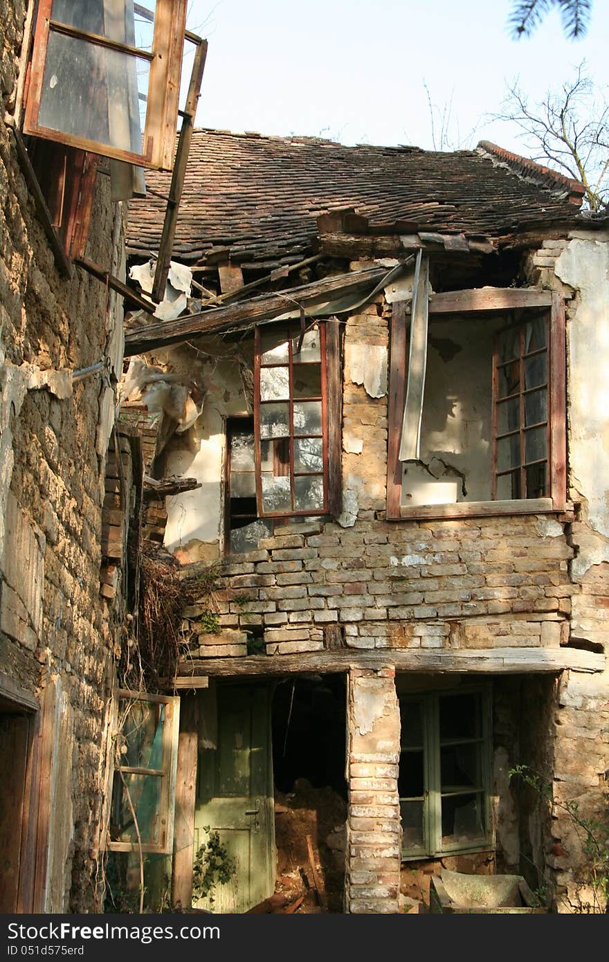 Old, ruined storey building with broken windows. Old, ruined storey building with broken windows