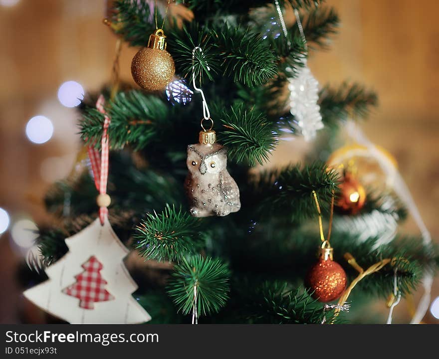 The New Year tree is decorated by toys the made hands. The New Year tree is decorated by toys the made hands