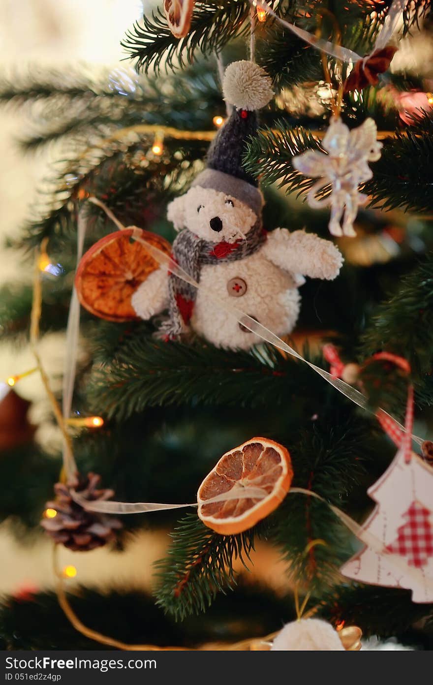 The New Year tree is decorated by toys the made hands. The New Year tree is decorated by toys the made hands