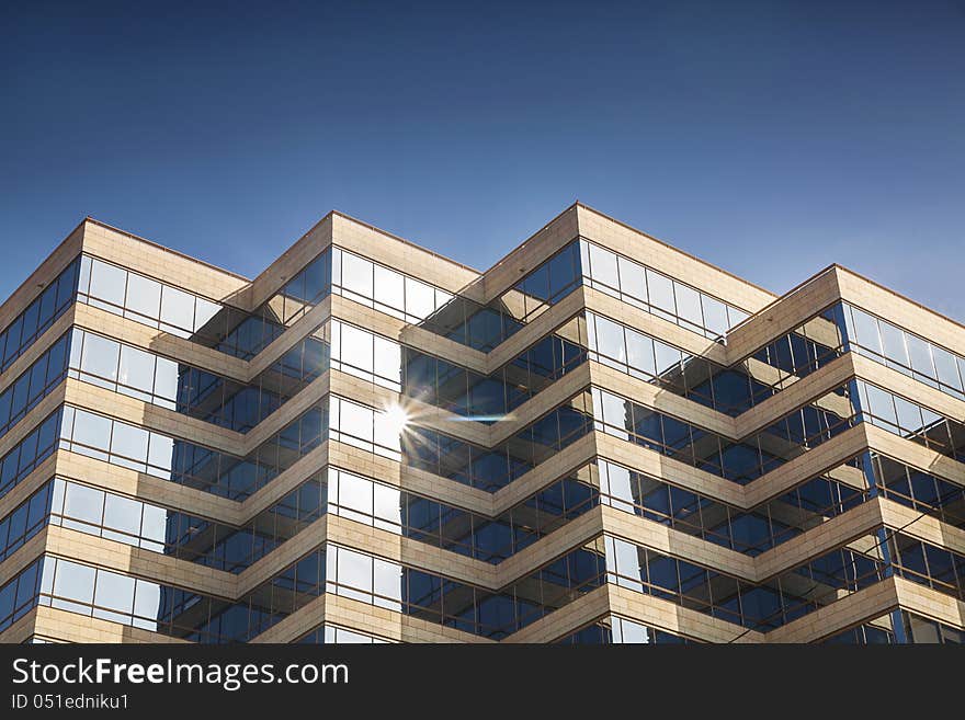 Modern Office Building Glowing In Sunshine