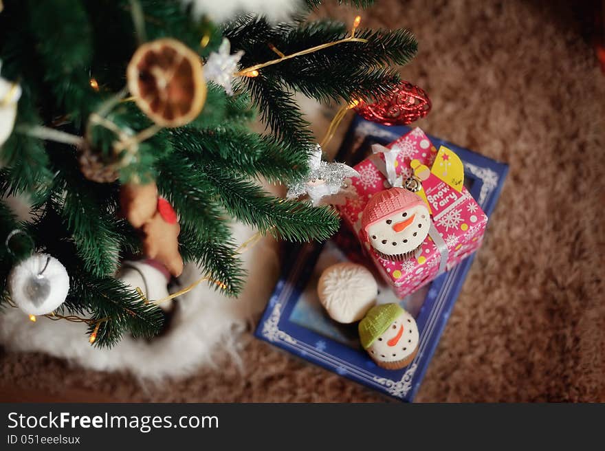 The New Year tree is decorated by toys the made hands. The New Year tree is decorated by toys the made hands