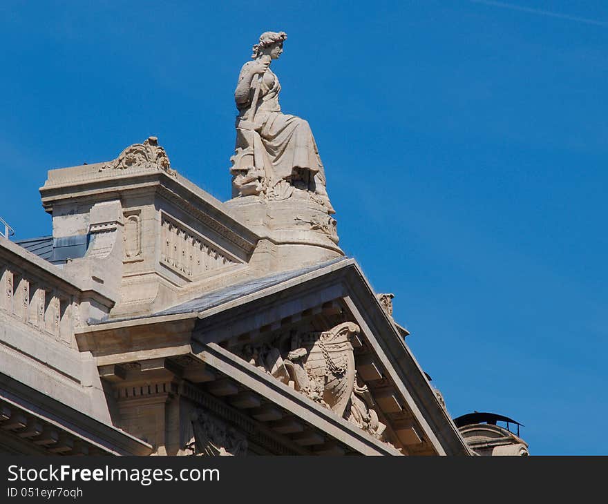 Grand Place In Brussels. Architectural detail at the Grand place statue on the roof Belgium.