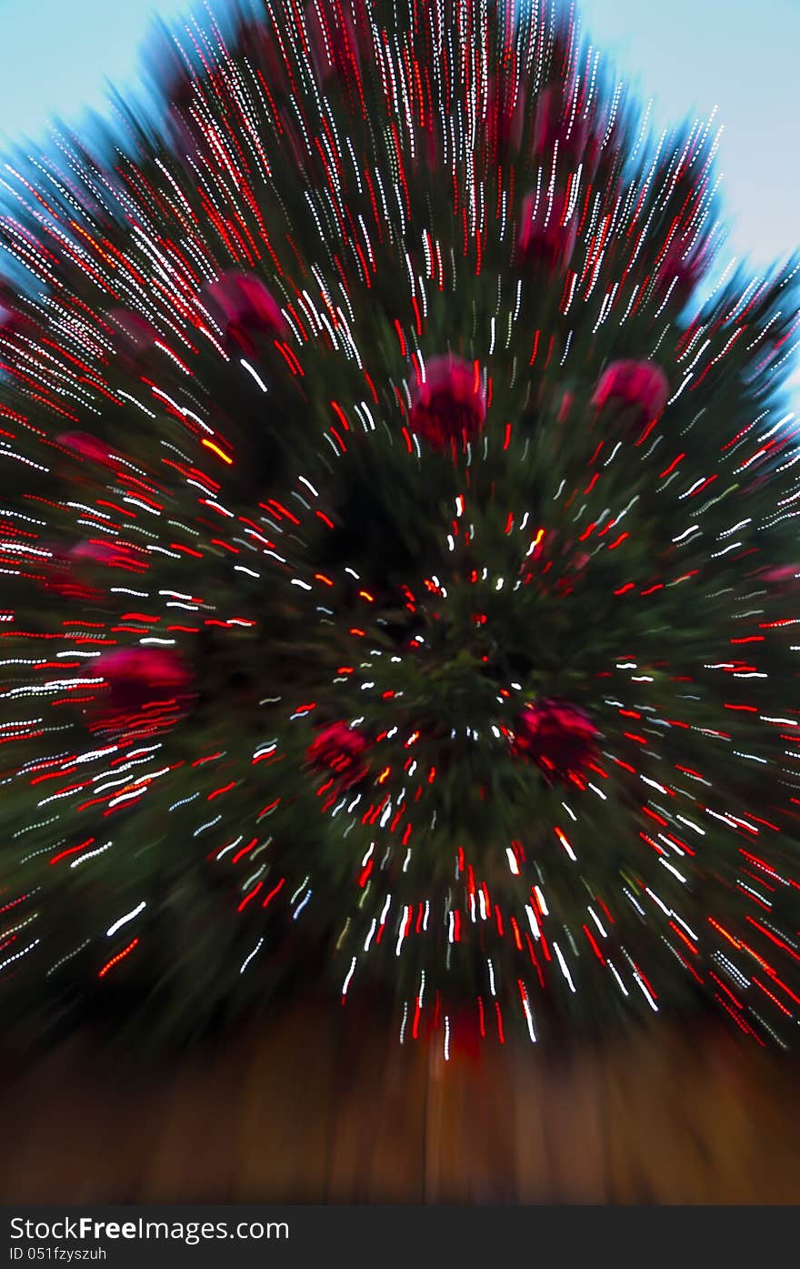 Zoomed photo pf a Christmas Tree looks as an explosion of colors and light.