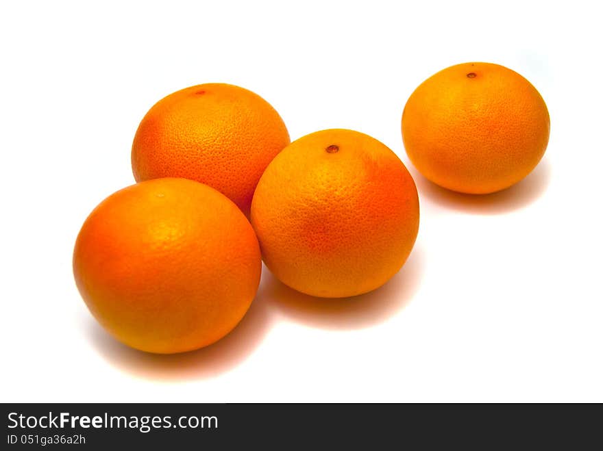 Four fresh tangerines on white