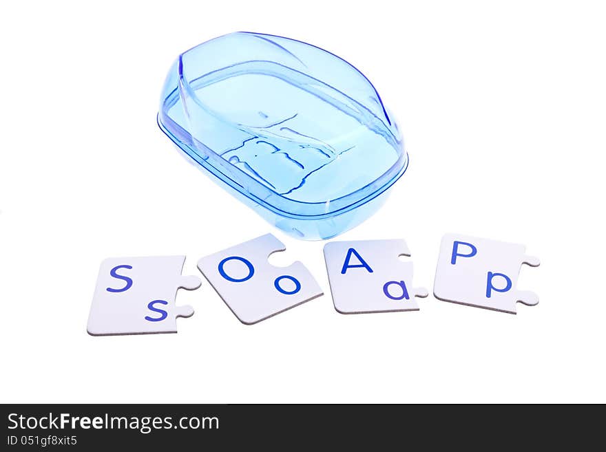 Blue soap-dish and puzzle pieces