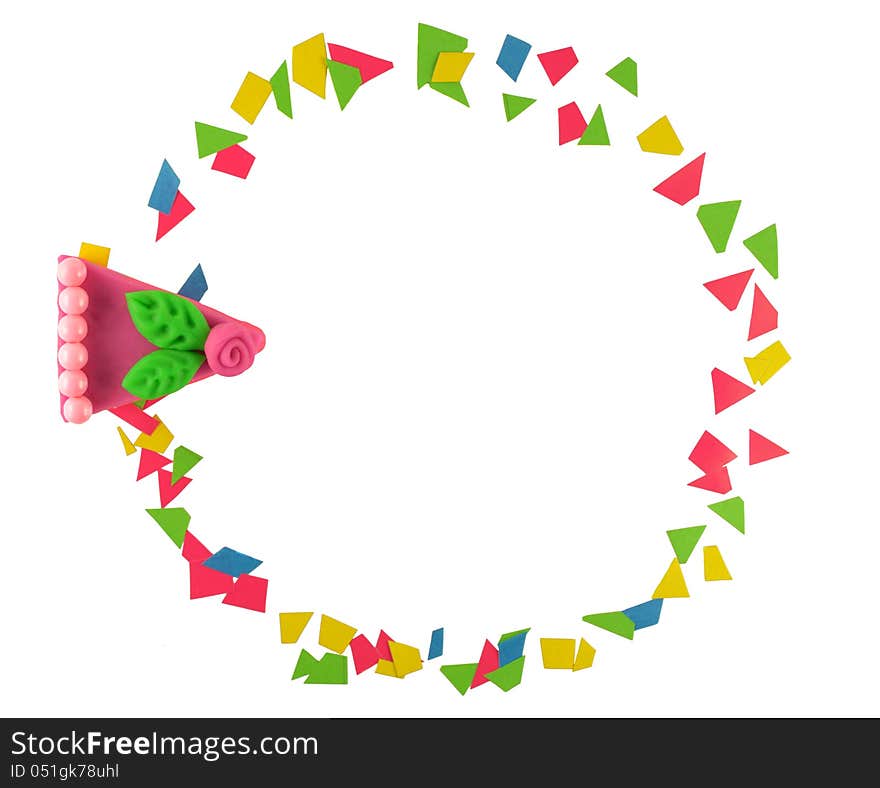 The colorful frame with paper cutouts and cake piece made of play dough. The colorful frame with paper cutouts and cake piece made of play dough