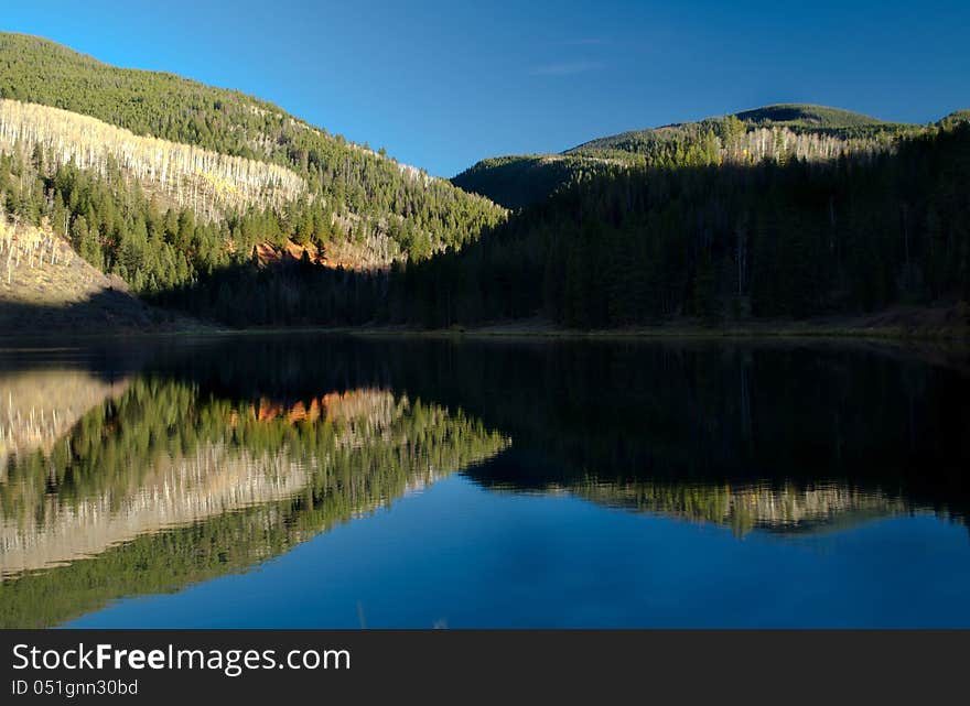 A reflective Mountain lake in Colorado. A reflective Mountain lake in Colorado