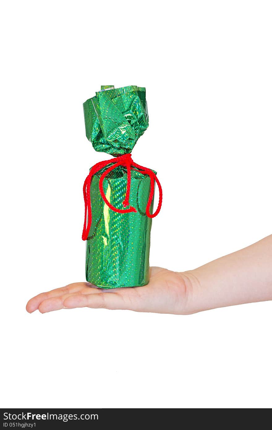 Holiday gift in bright green packaging on a female hand