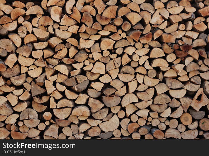 A wall of chopped wood texture background. A wall of chopped wood texture background