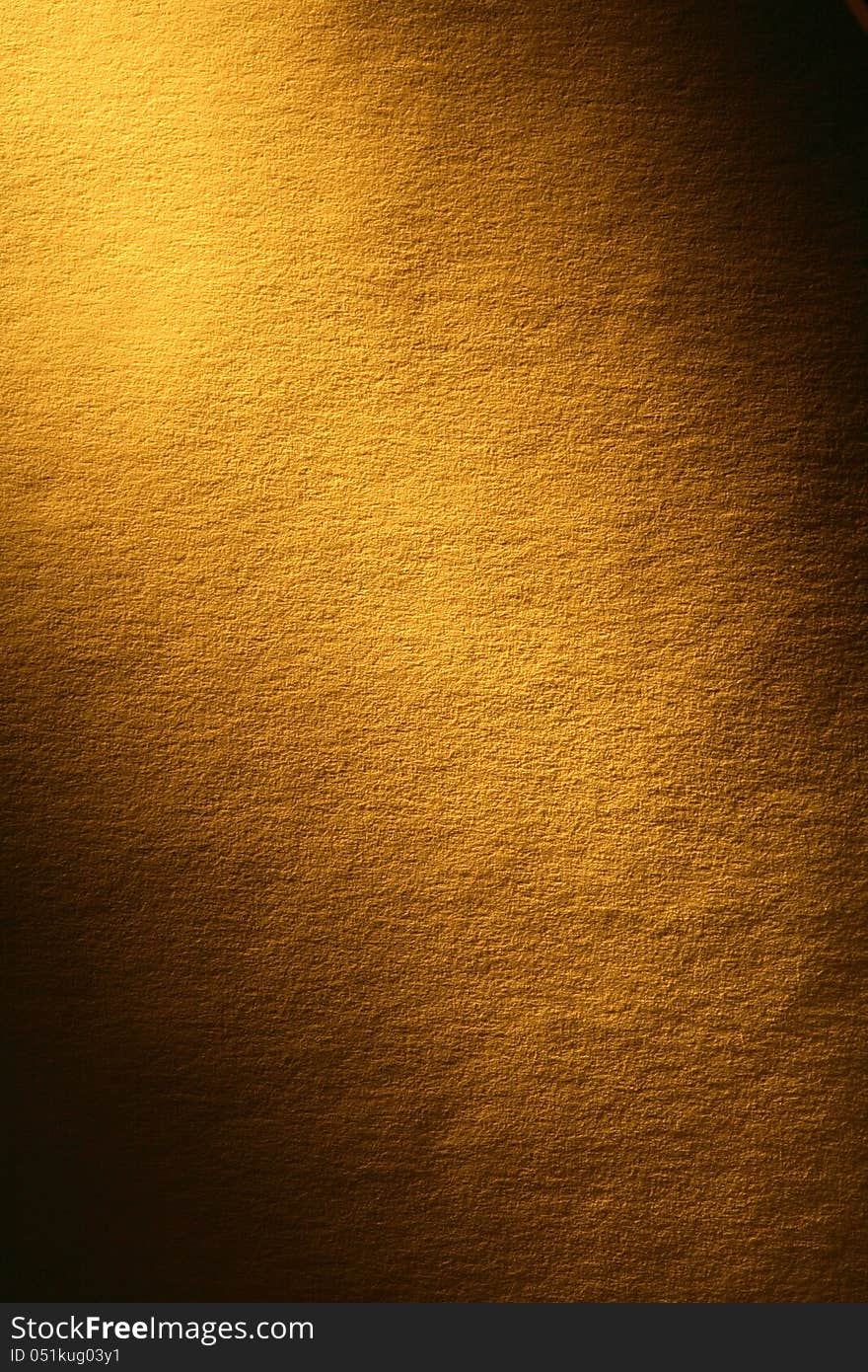 Old yellow paper surface with beam of light. Good background for your text. Old yellow paper surface with beam of light. Good background for your text