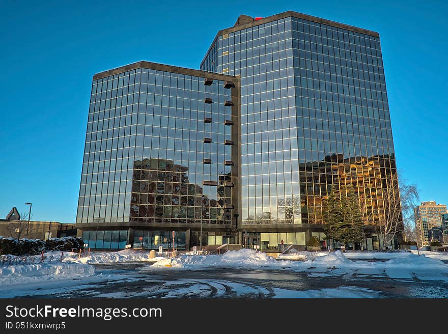 Modern glass building wintertime late afternoon