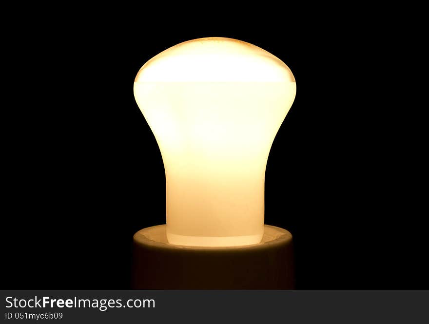 A bright light bulb in black background.