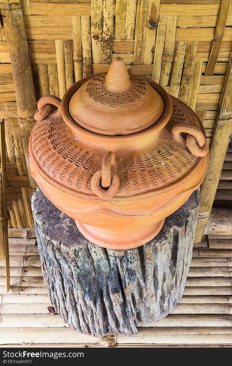 Thai style - antique clay drinking water jar for guest at bamboo cottage