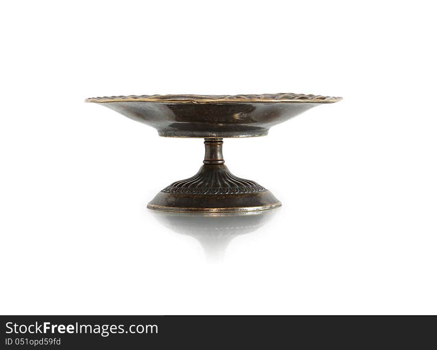 Nice ancient bronze fruit bowl on white background. Clipping path is included. Nice ancient bronze fruit bowl on white background. Clipping path is included