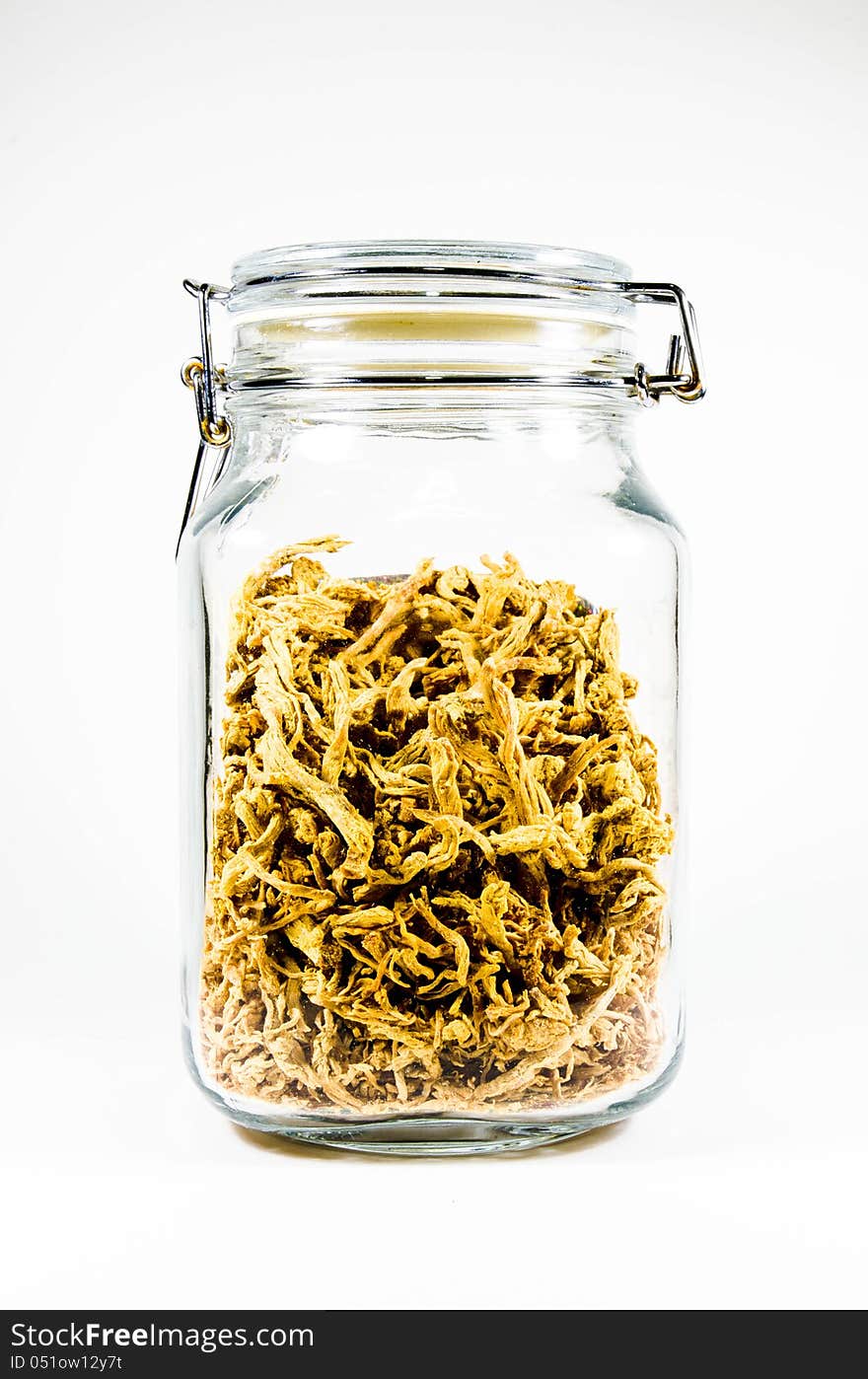 Dried shredded pork in glass bottle  on white background