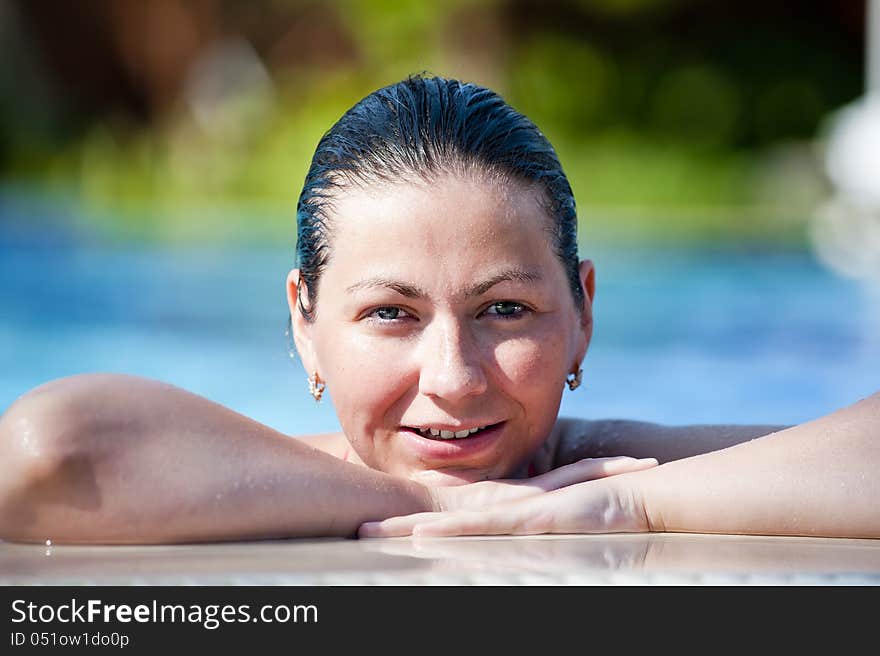 Portrait of happy girl in pool