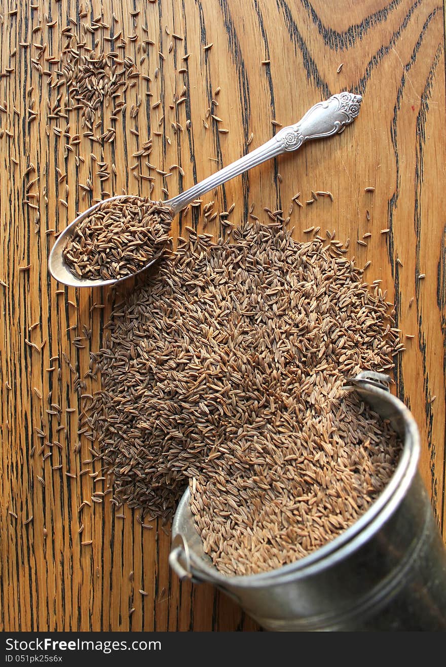 Cumin Seeds On Wooden Background