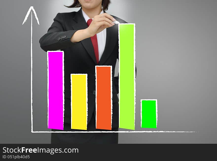 Business woman drawing growing graph