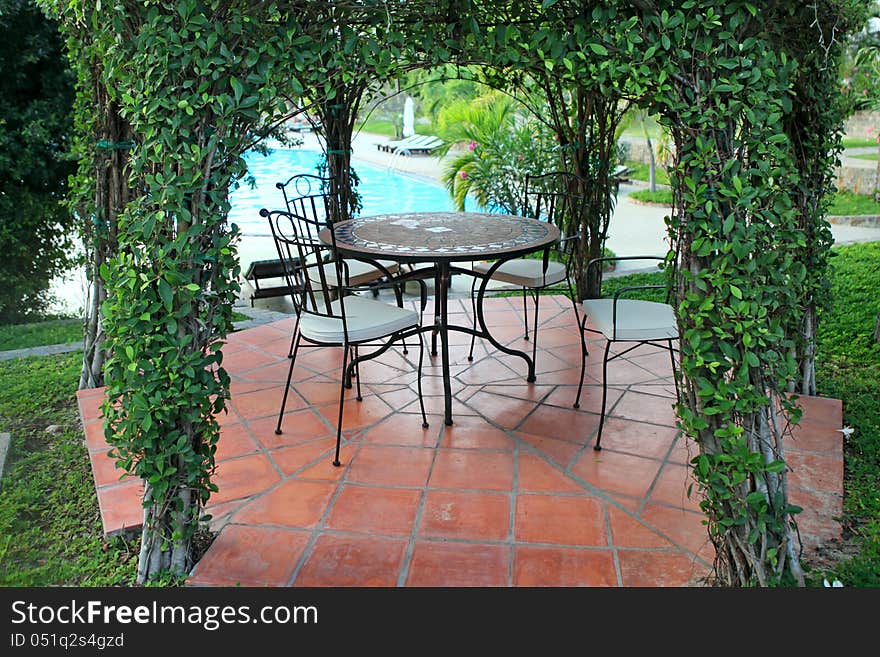 Beautiful green gazebo pavilion in the resort garden. Beautiful green gazebo pavilion in the resort garden