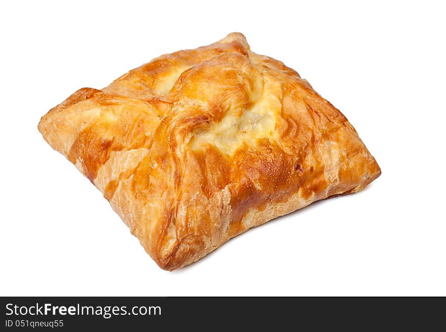 Pie from flaky pastry on a white background