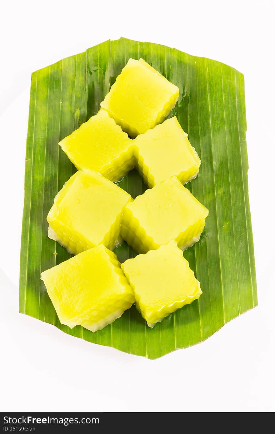 Thai dessert called Thai sweetmeat on banana leaf isolated on white background