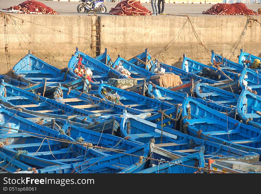 Blue fishing boats in port of Essaouria, Morocco