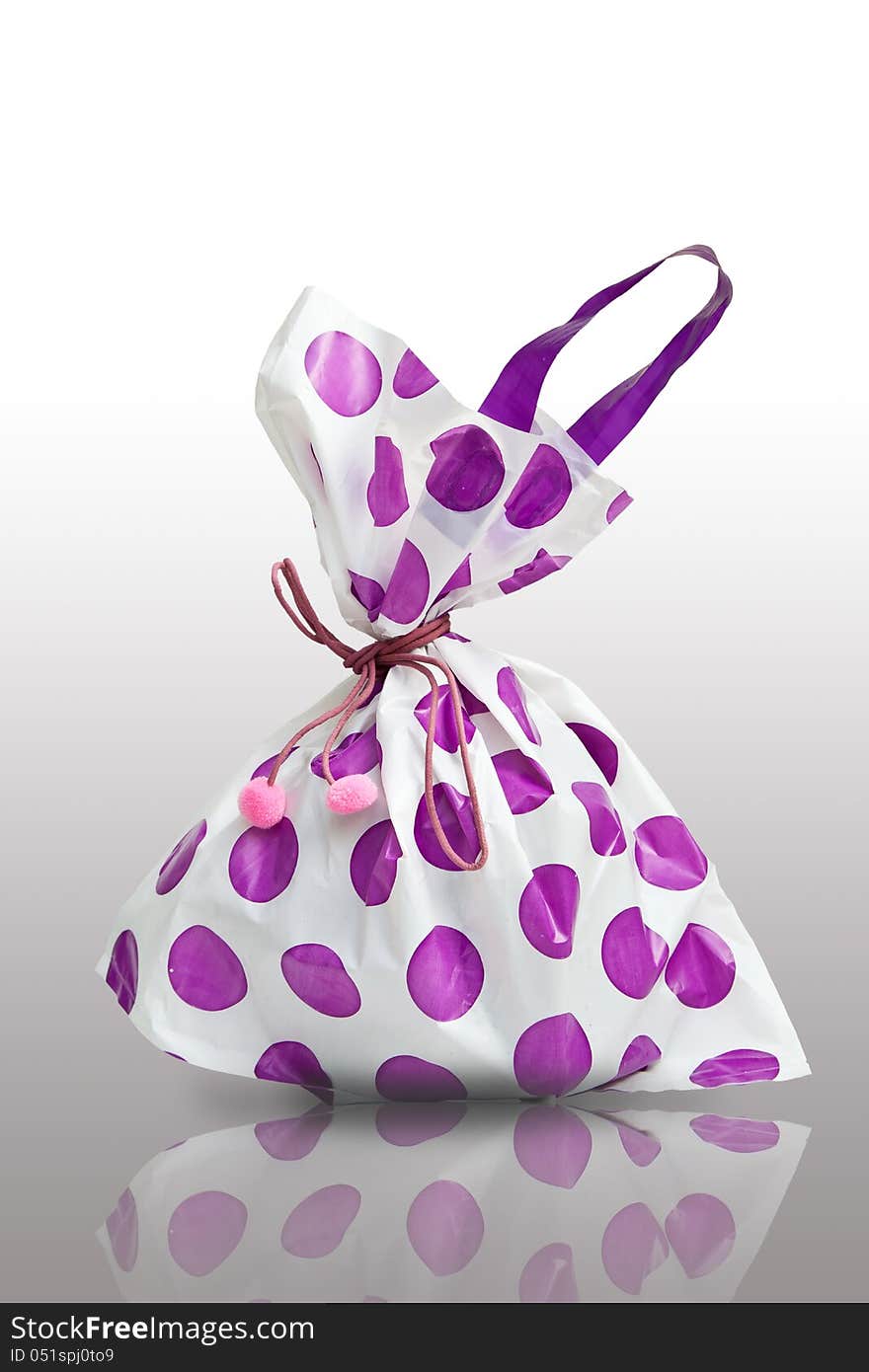 PURPLE SHOPPING BAG TIED WITH A PINK ROPE