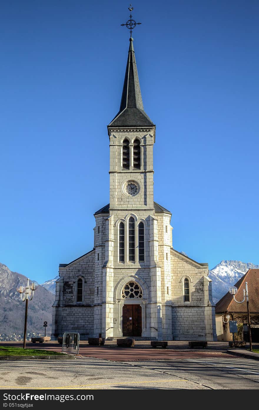 Church in the French Alps town of Sevrier on Lake Annecy. This is taken with the Alps in the background on a clear blue cold and sunny winter day. Church in the French Alps town of Sevrier on Lake Annecy. This is taken with the Alps in the background on a clear blue cold and sunny winter day.