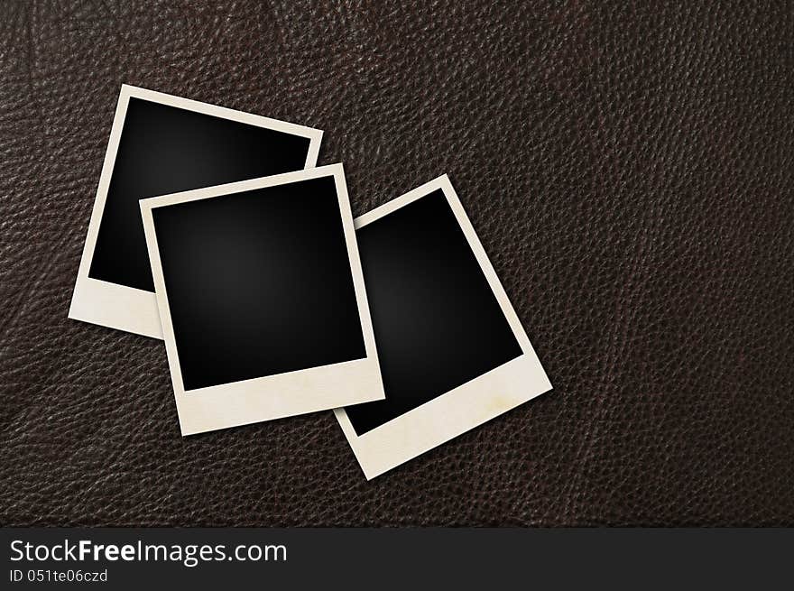 Instant films on brown leather background. Instant films on brown leather background