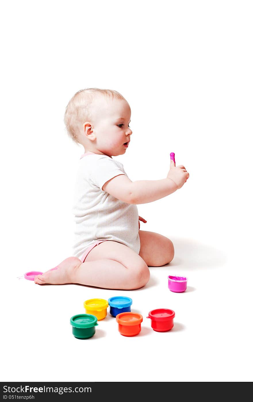 Year-old child playing with color paints. Year-old child playing with color paints