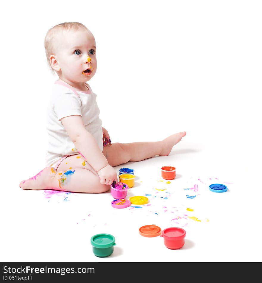 Year-old child playing with paints. Year-old child playing with paints