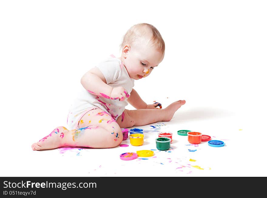 Year-old child playing with paints. Year-old child playing with paints