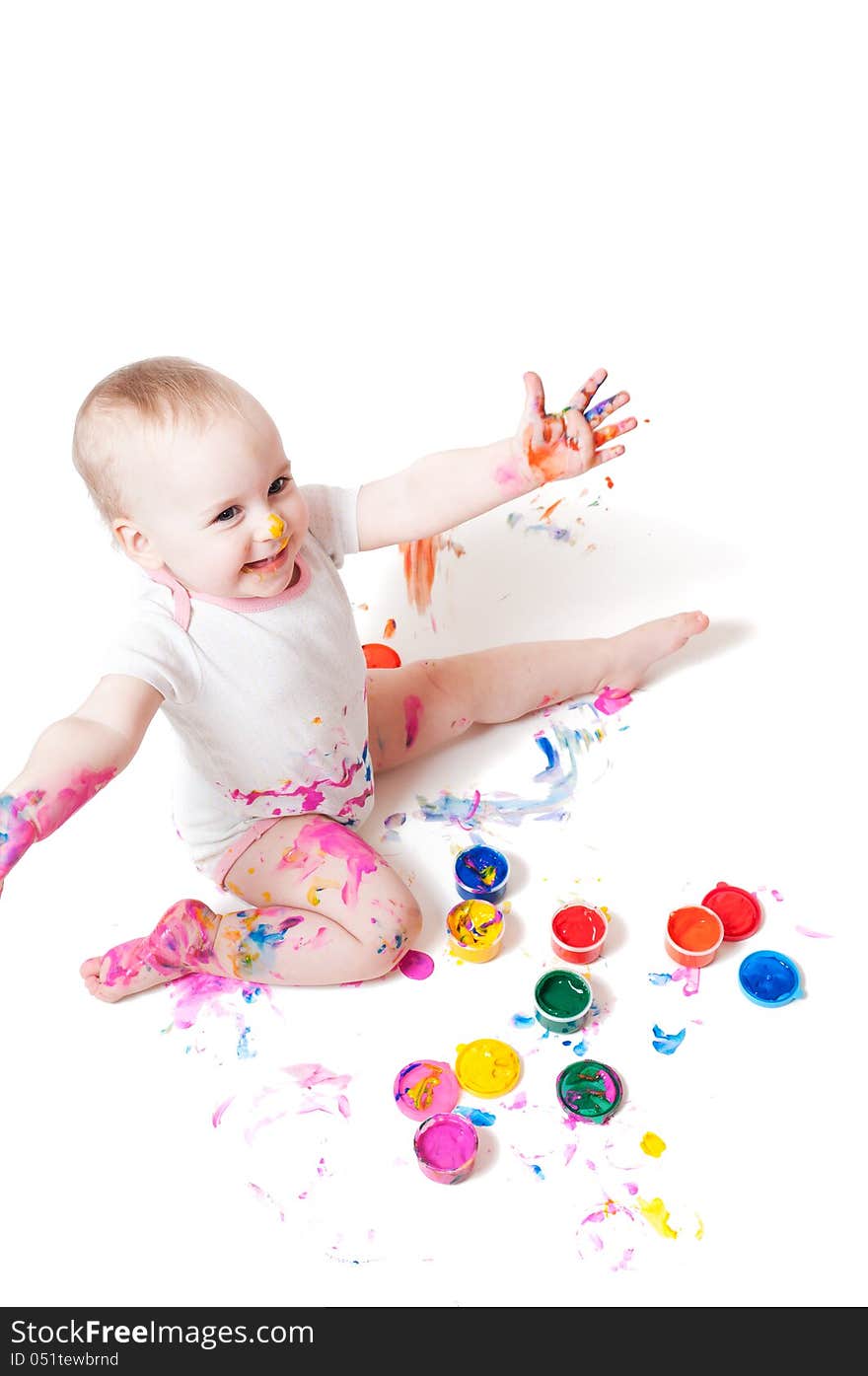 Year-old child playing with paints. Year-old child playing with paints