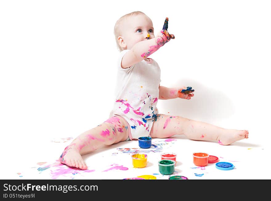 Year-old child playing with paints. Year-old child playing with paints