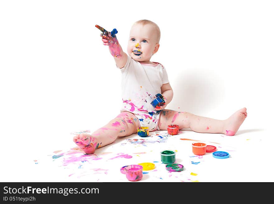 Year-old child playing with paints. Year-old child playing with paints